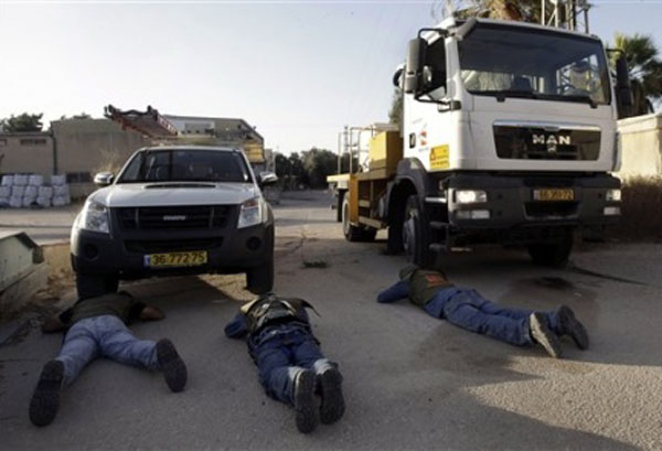 Workers of Israel Electric Company take cover from Hamas rockets