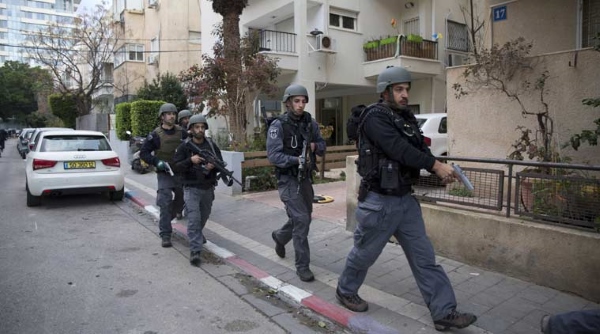 Police comb North Tel Aviv for terrorist who killed at least two on Friday